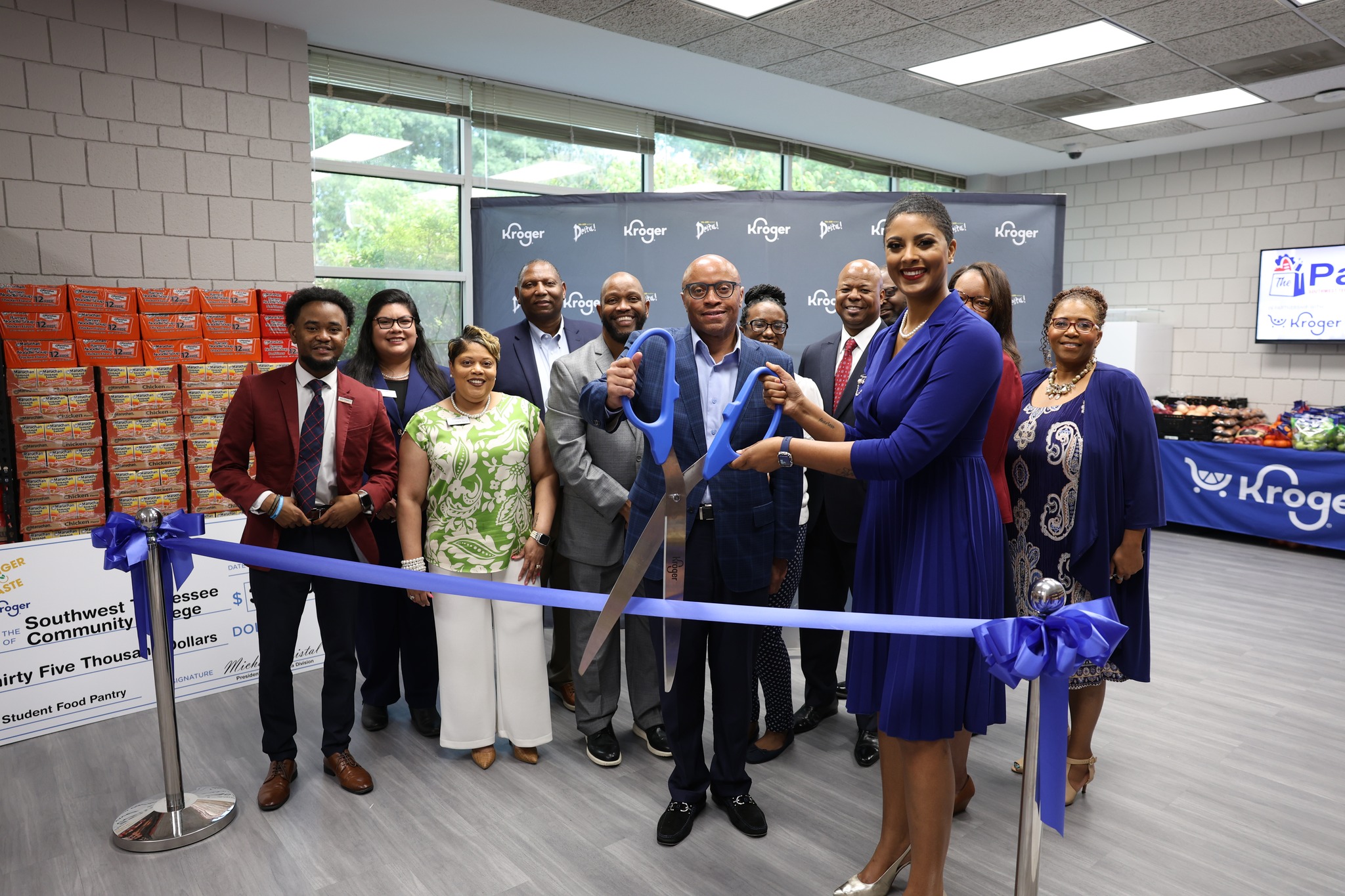 Southwest Tennessee Community College staff attend the ribbon cutting event of The Pantry along with Sheleah Harris (at right), corporate affairs director at Kroger, on Aug. 29, 2024.