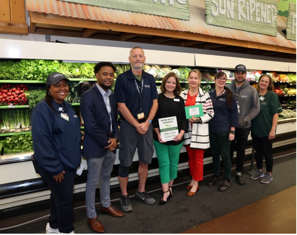 Sprouts Farmers Market employees and Southwest Community Community College staff members take a  photo at a grant donation ceremony on Sept.7, 2024.