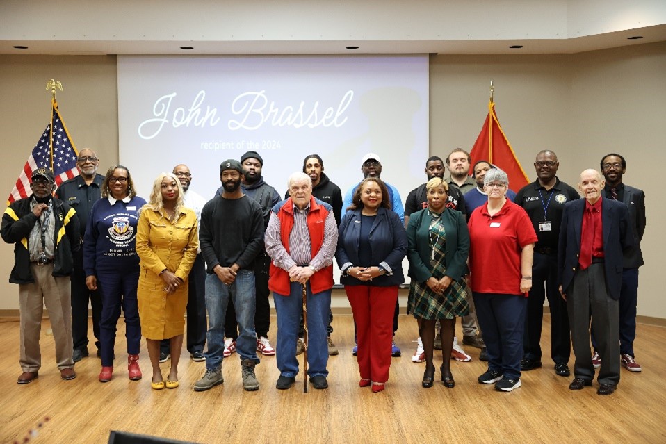 Dr. Tracy D. Hall with student and employee veterans at the Veteran Employee and Student Appreciation and Recognition ceremony on Nov. 11, 2024.