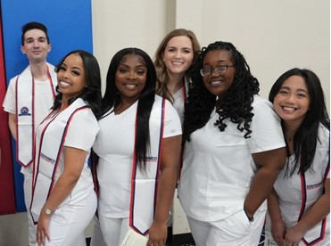 Registered Nursing student graduates celebrate at the 2024 Pinning Ceremony on December 13, 2024.