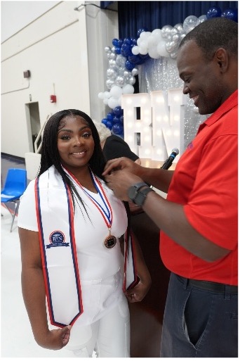 Registered Nursing student receives pin at the 2024 Pinning Ceremony.