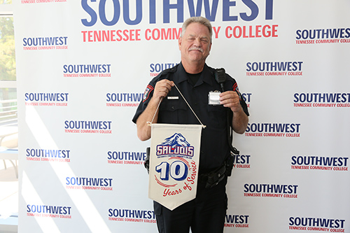 employee with flag showing years of service