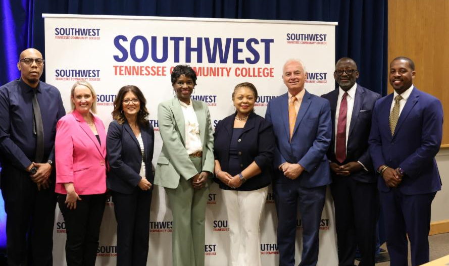 participants of Open House standing infront of SWTCC banner